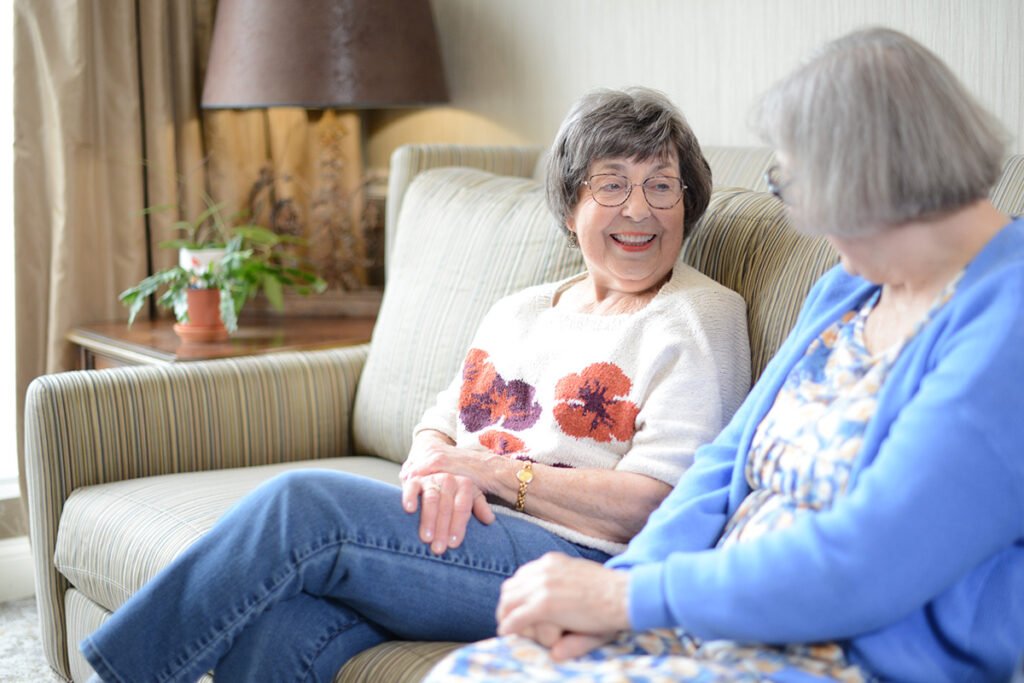 two women on a couch