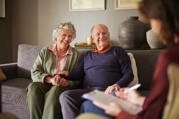 Elderly patients engaging with a medical practitioner for health advice and insurance guidance.